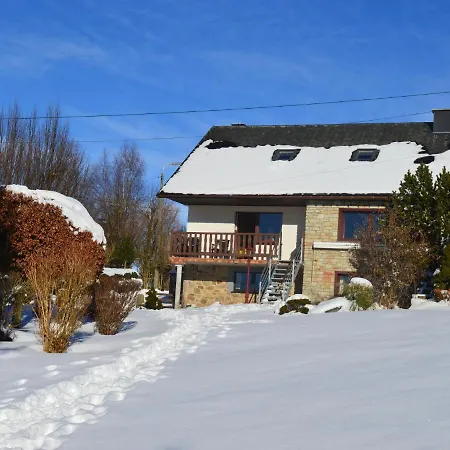 House With Beautiful Wooden Balcony Located Against The Hills Ondenval